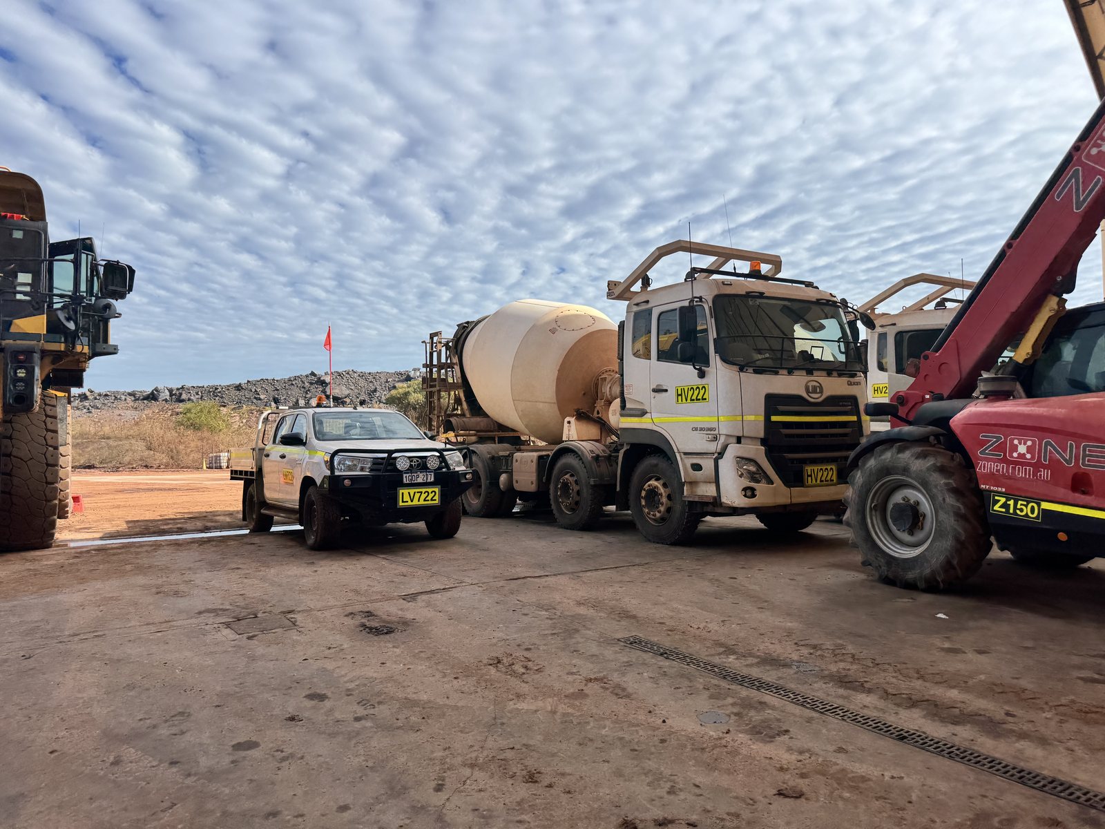 Workshop yard with service ute, mixer and telehandler